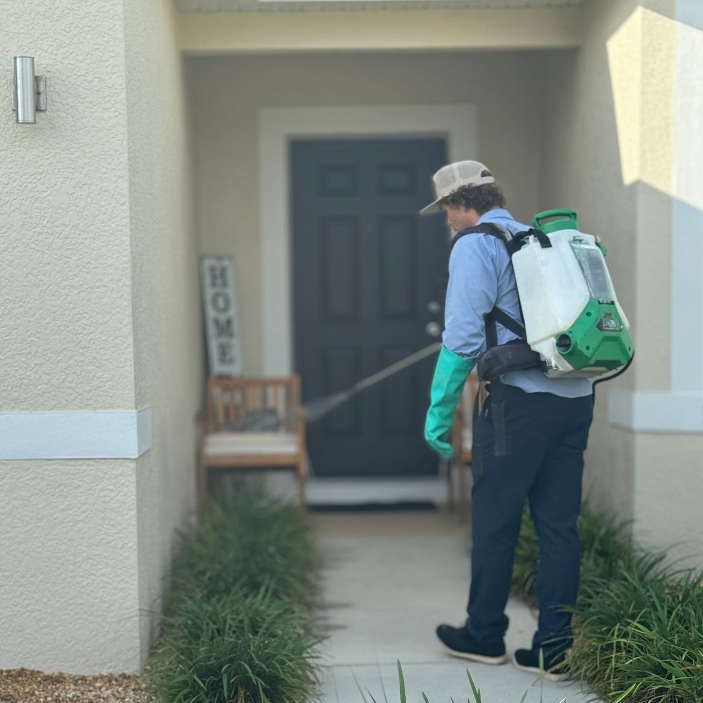 Pest Technician Spraying for Bugs